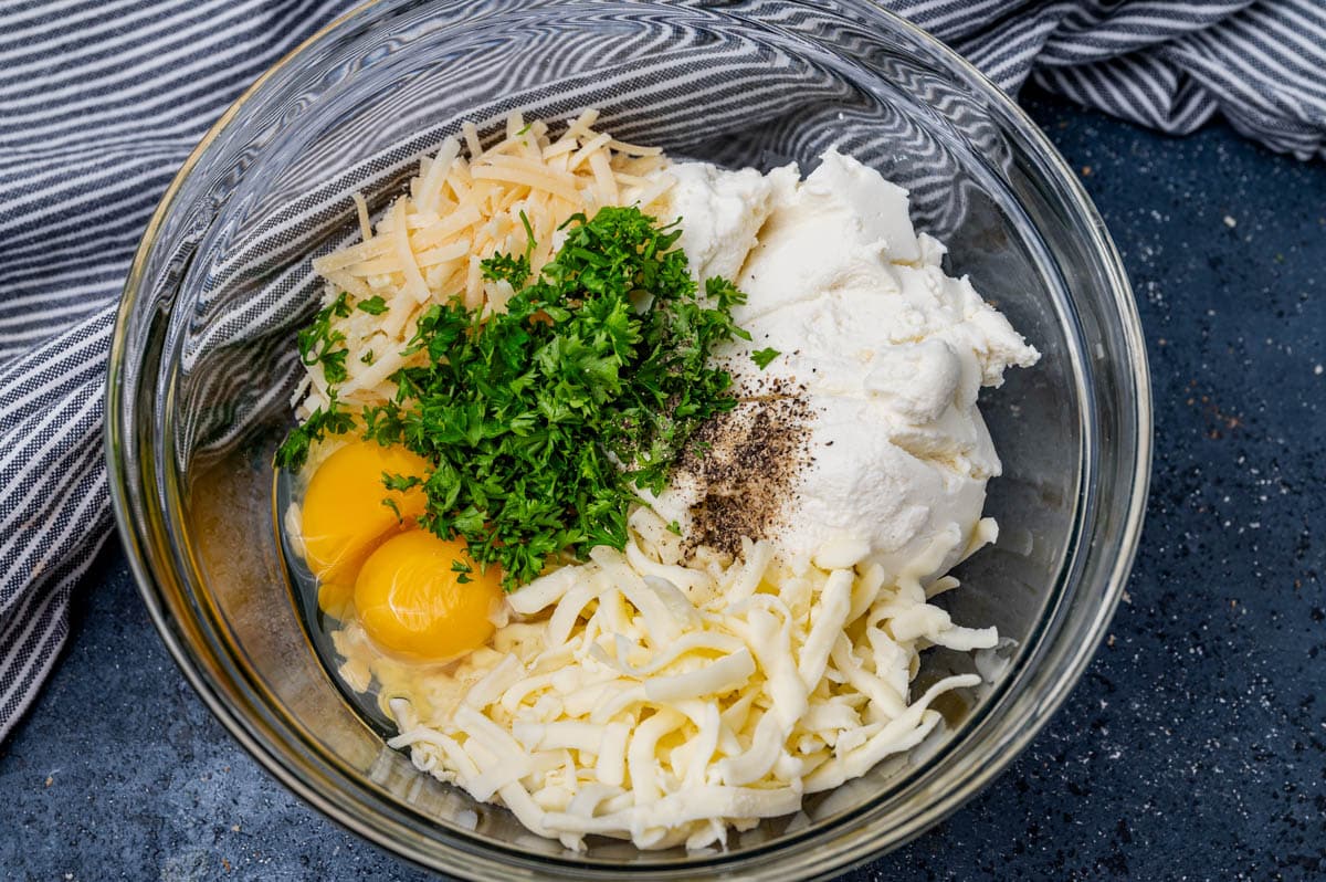 ingredients for cheesy lasagna filling in a bowl