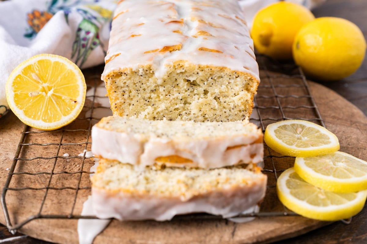 glazed lemon poppy seed bread sliced on a table