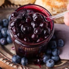 blueberry compote in a jar with a spoon