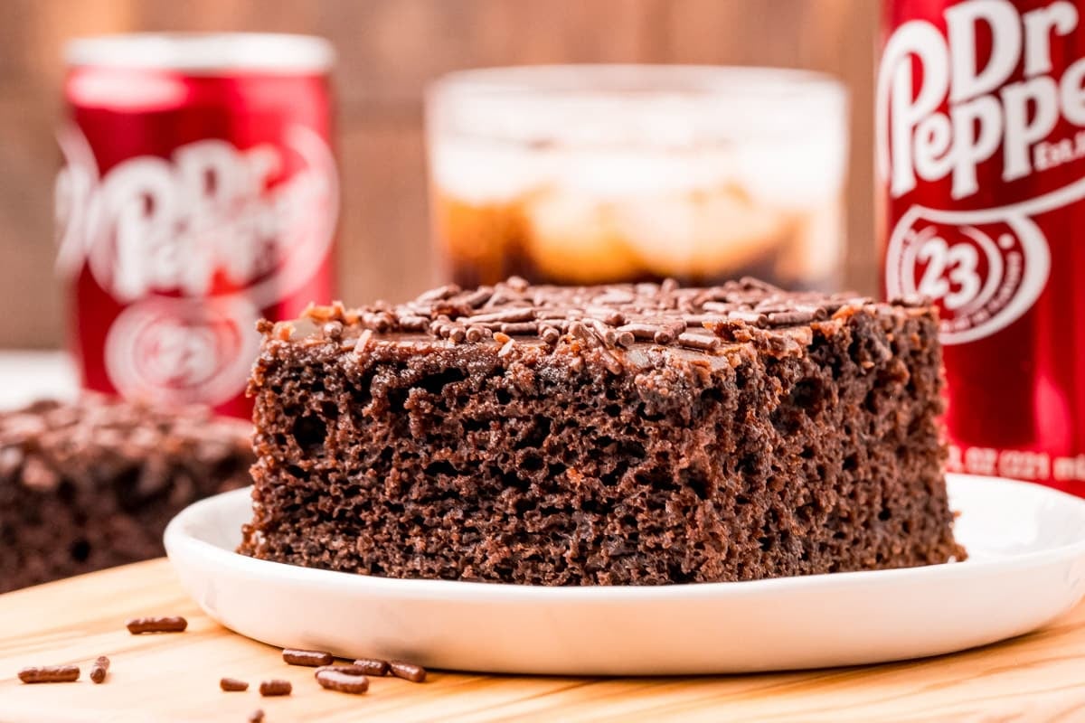 a slice of dr pepper cake on a table