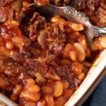 3 bean baked beans in a dish with a spoon