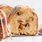a slice of cinnamon peach bundt cake on a spatula