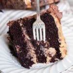 a slice of german chocolate cake with a fork in it