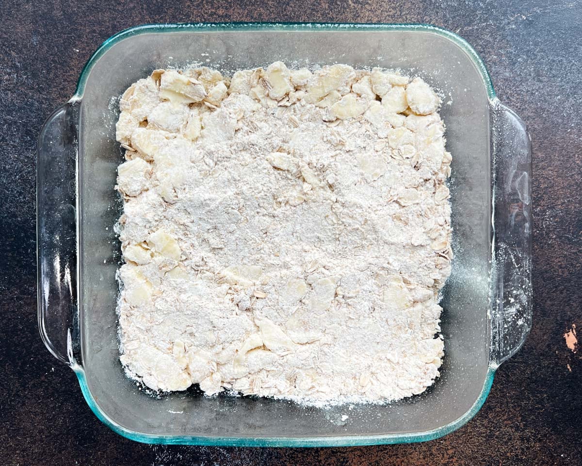buttery crumble crust in a pan