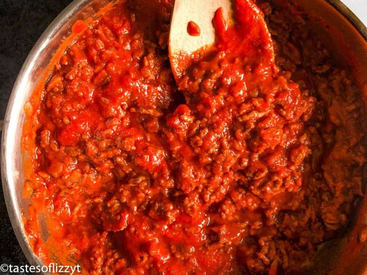 meat sauce in a pan with a spatula